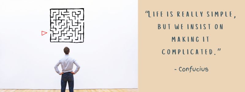 A man standing trying to make sense of a complex maze